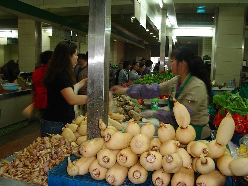 DSC01893.JPG - Brenda buying lotus root at the market. 22 October 2009