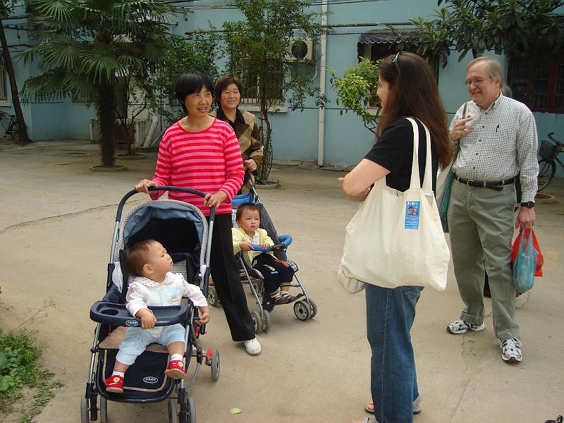 DSC01905.JPG - Brenda and Bill talking to the grannies of the children in the apartment complex. 22 October 2009