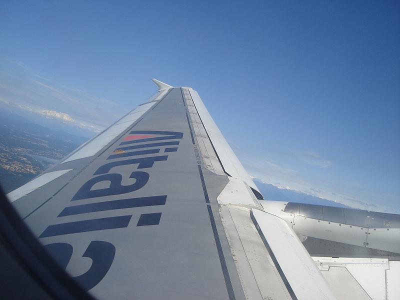 DSC01002.JPG - The wing of our plane with the Italian Alps in the distance. 12 July 2007