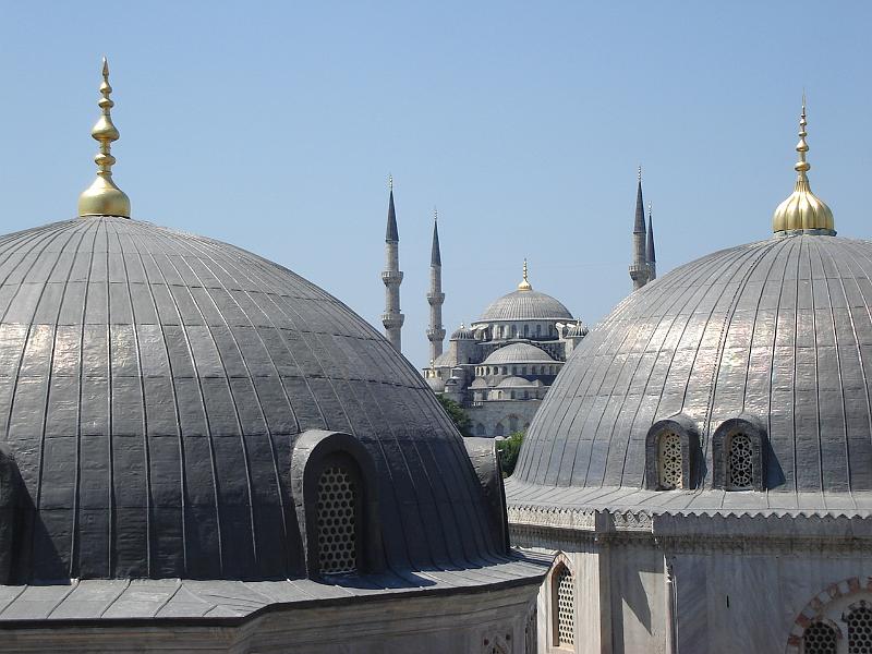 DSC01371.JPG - Two domes of the Haghia Sophia (Aya Sofya Camii) with the Blue Mosque (Sultan Ahmet Camii) outside a tiny window of the Hagia Sophia (Aya Sofya Camii). 17 July 2007