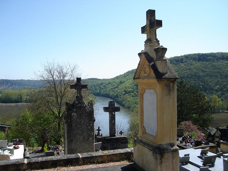 DSC02540.JPG - A small cemetery on the way up to Castelnaud, with the Dordogne River in the background.  France 24 April 2008
