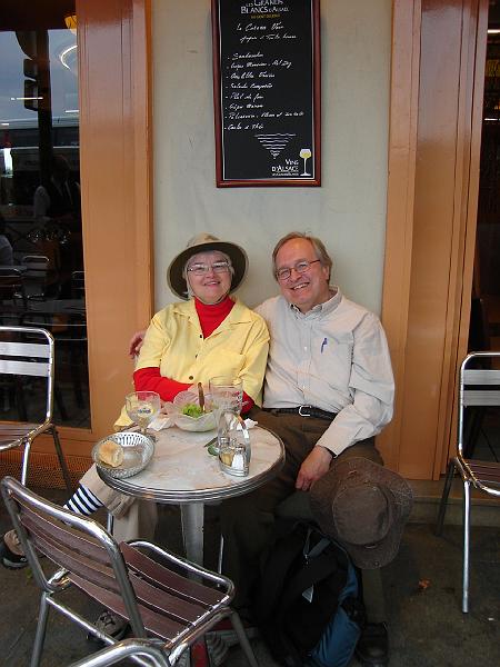 DSC02686.JPG - Judy and Bill in a sidewalk cafe on the right bank of the Seine, after enjoying a rather pricey snack of beer and salad Nicoise.  Paris France 27 April 2008