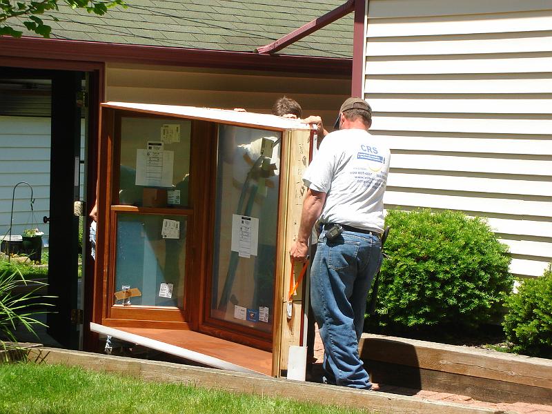 DSC01145.JPG - Josh, Davy, and Brian hauling bay window. 9 June 2009
