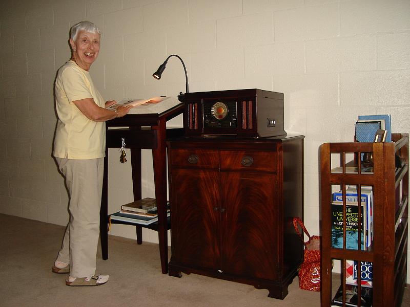 DSC01389.JPG - Ramona at her dictionary stand in front of her media center. 8 August 2009