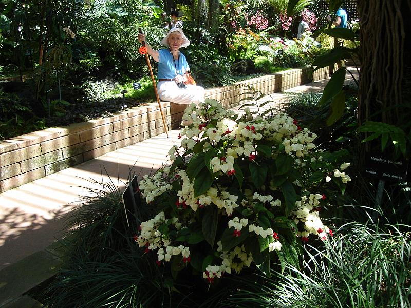 DSC01414.JPG - Ramona in the botanical gardens with a red and white bleeding heart plant. 9 August 2009