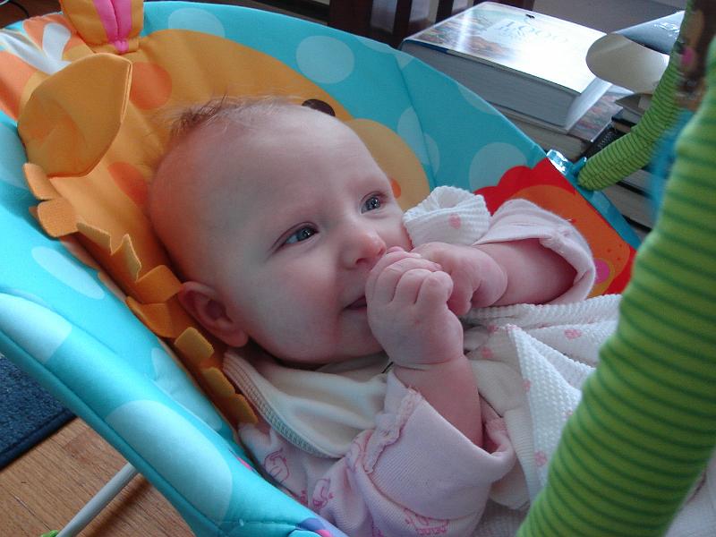DSC01542.JPG - Avery trying to eat her fist. 26 September 2009