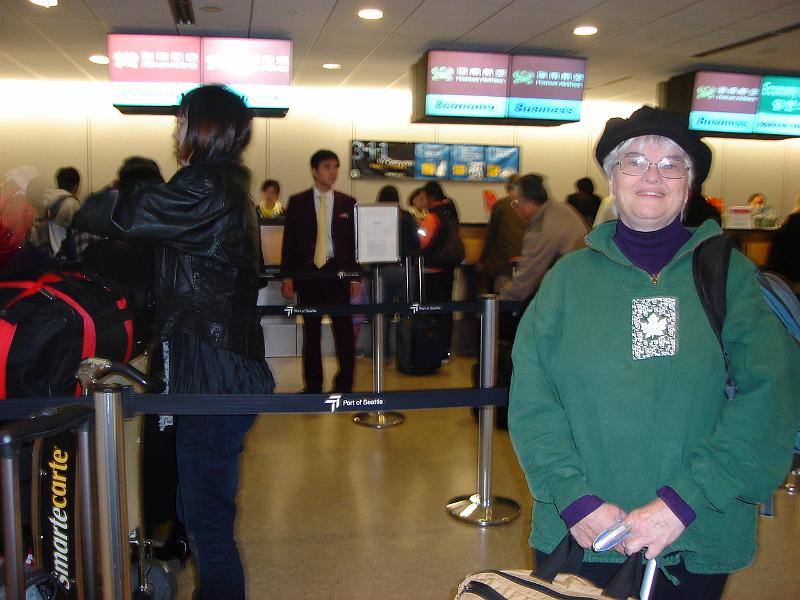 DSC01844.JPG - Judy checking in to Hainan Airlines flight 496. 19 October 2009
