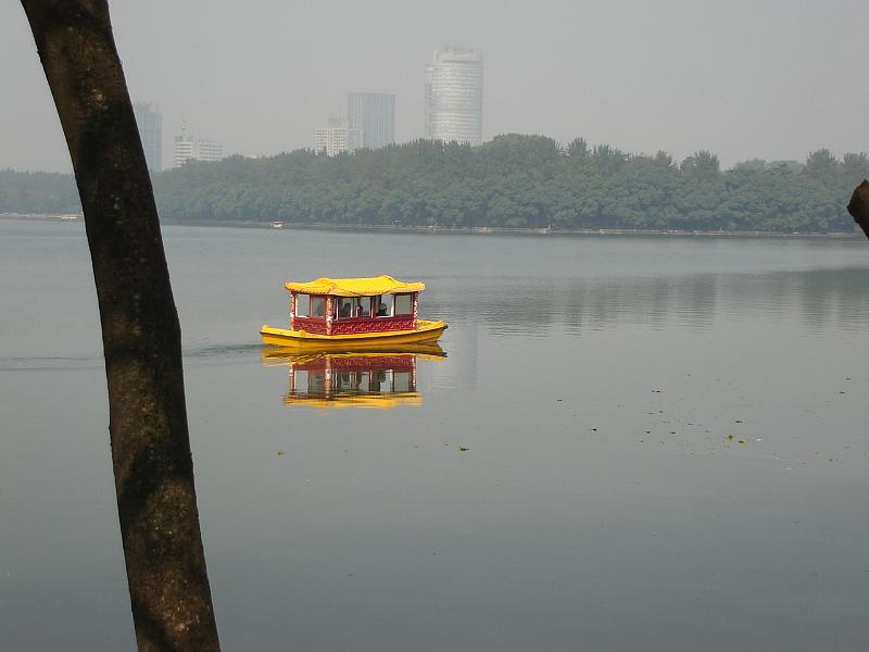 DSC01960.JPG - Boat on Xuanwu Lake with high rise buildings of Nanjing in the background. 23 October 2009