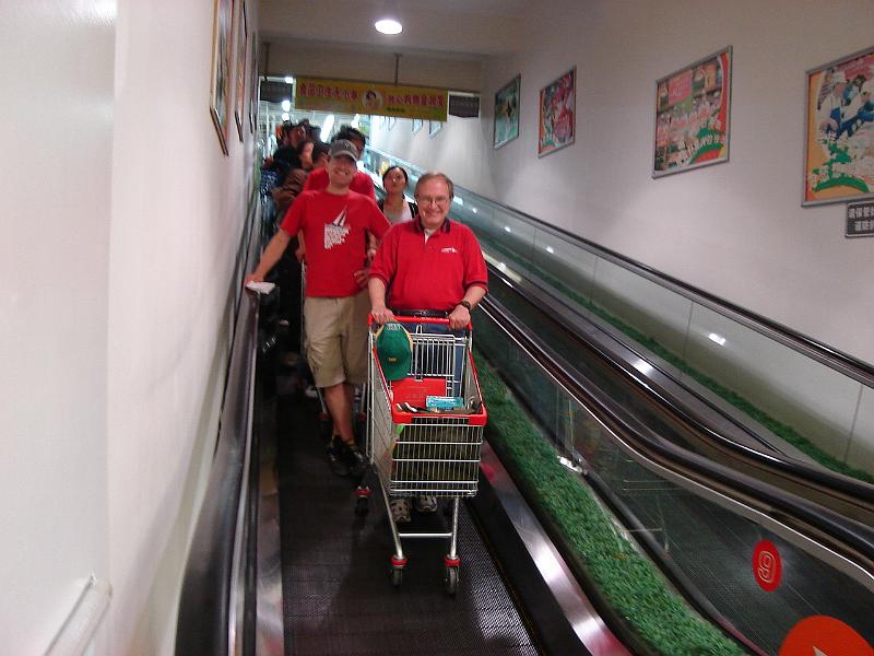 DSC02041.JPG - Bill and Andrew coming down a level while shopping at the RT Mart. 24 October 2009