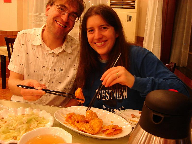 DSC02049.JPG - Dinner at their favorite restaurant included spicy chicken with peanuts, western style celery with cashews, spicy four-season green beans, candied sweet potatoes, and fatty pork soup with sweet potato noodles. 24 October 2009