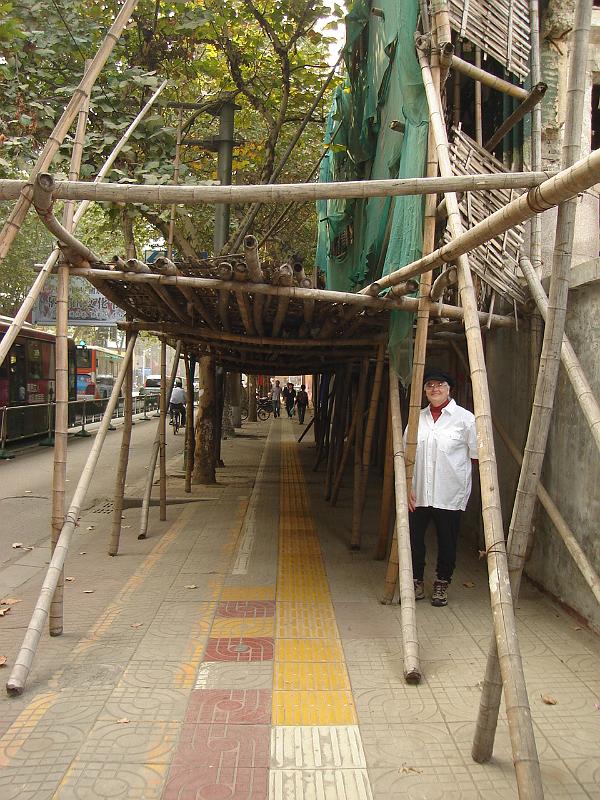 DSC02064.JPG - Chinese scaffolding being inspected by a member of Luther Memorial's High Maintenance Committee. 25 October 2009