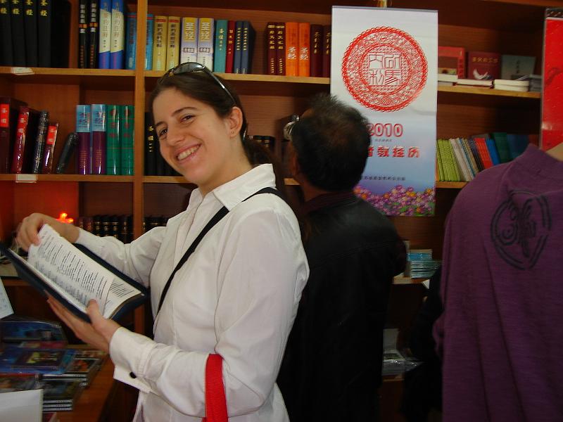DSC02066.JPG - Brenda in the church's bookstore. 25 October 2009