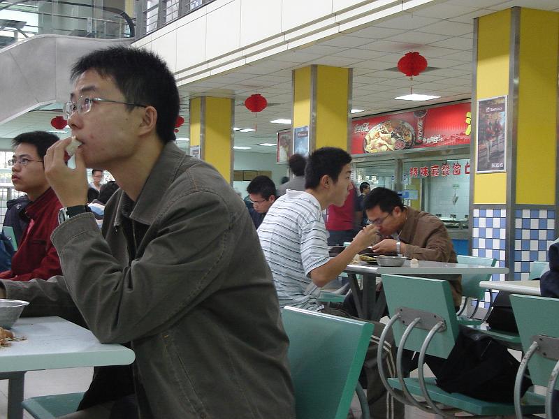 DSC02132.JPG - At the Shitang for breakfast.  They, like us, are glued to the sports results. 27 October 2009