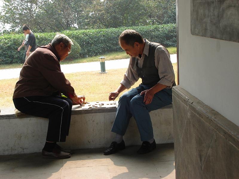 DSC02312.JPG - Two men playing a game in the pavilion on Lion Hill. 30 October 2009