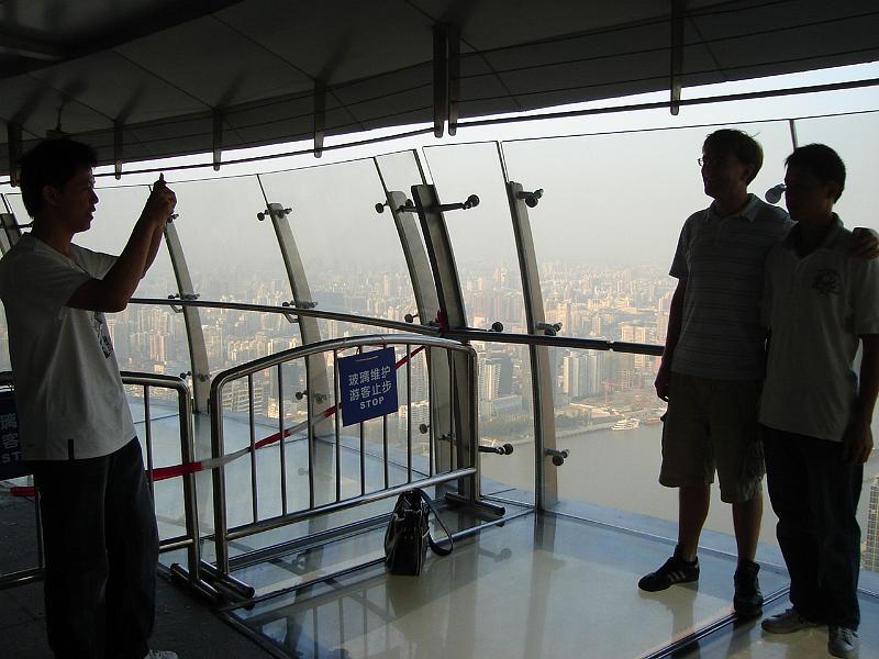 DSC02449.JPG - Taking a picture of a guy taking a picture of the waiguoren, the foreigner.  We often had our pictures taken,  usually were not asked, and were pointed out by adults to children, especially when all four of us were together. 31 October 2009