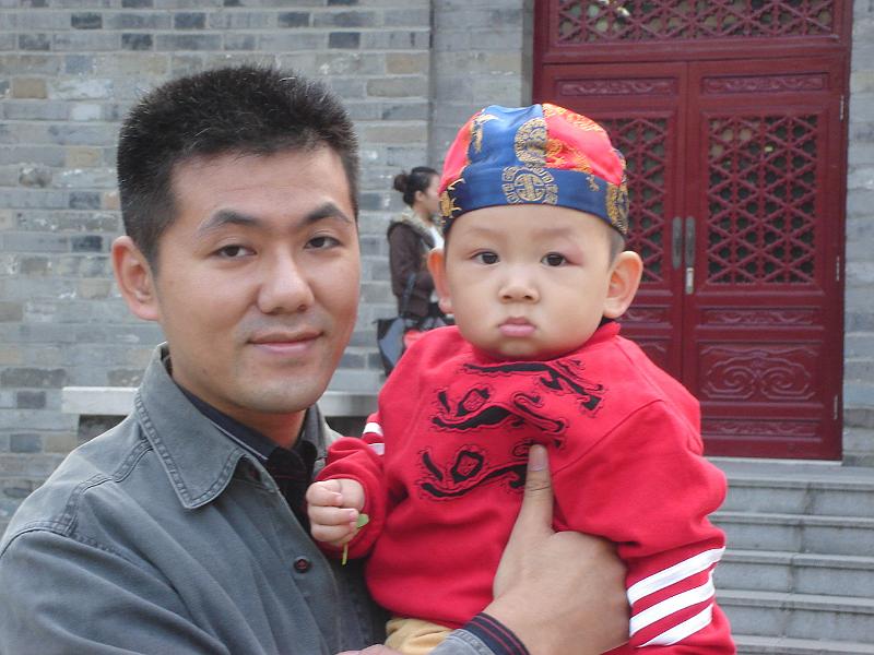 DSC02494.JPG - A man with his son. 1 November 2009