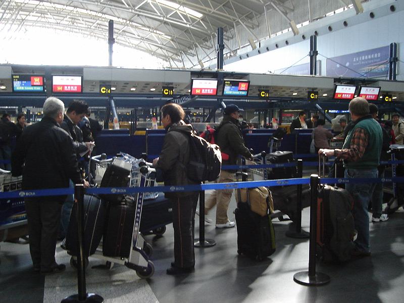 DSC02543.JPG - Waiting in line at the Beijing airport to check our luggage to SeaTac. 2 November 2009