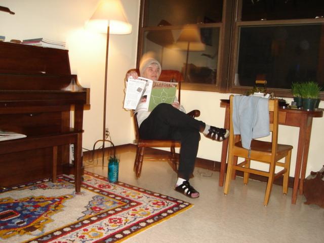 DSC00127.JPG - 24 February 2006 trip to Urbana.  Judy studying Andrew's latest publication - in Andrew and Brenda's living room. 24 February 2006