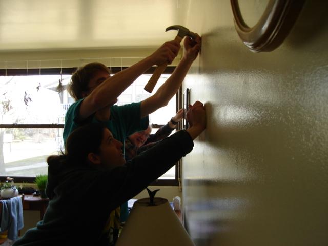 DSC00139.JPG - Bill, Andrew, Brenda - just how many people does it take to hang a small picture? 25 February 2006