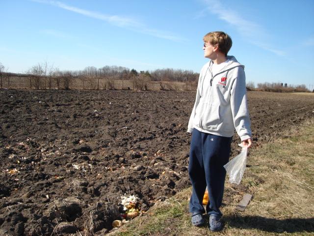 DSC00188.JPG - Andrew.  Out standing in his field.  The garden plots behind Orchard Downs. 26 February 2006