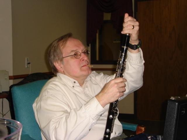 DSC00237.JPG - Bill moistening a reed to join Gretchen in the concert. 23 March 2006