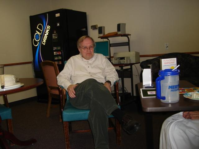 DSC00245.JPG - The master clarinetist at rest, another performance behind him.  Actually it is a soda machine. 23 March 2006