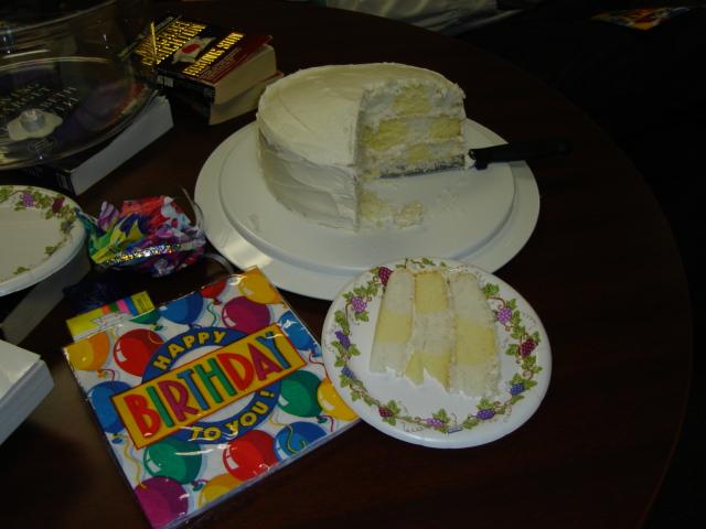 DSC00248.JPG - Checkerboard birthday cake, lemon and white, Lillian's favorite. 23 March 2006