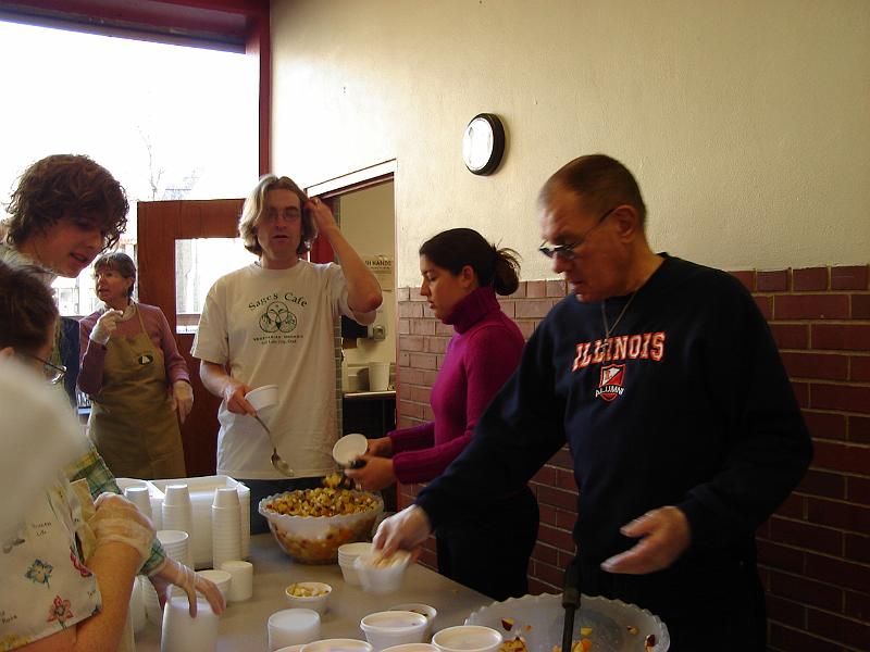 DSC00666.JPG - Andrew and Brenda, with others, at Porchlight helping to make Thanksgiving meals for delivery to the homebound. 23 November 2006