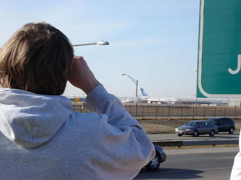 DSC00837.JPG - Andrew looking at the A380.  According to the Wisconsin State Journal, a Boeing 757 can hold 7,351,570 ping pong balls; and A380 can hold 35,000,000 of them. 20 March 2007