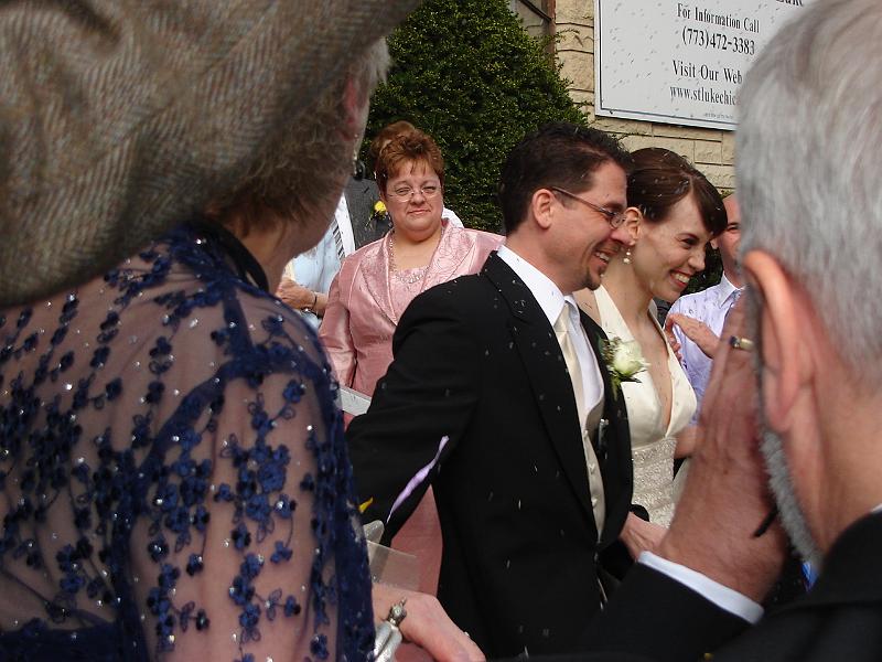DSC00879.JPG - Ray and Emily leaving the church with lavender flying. 28 April 2007