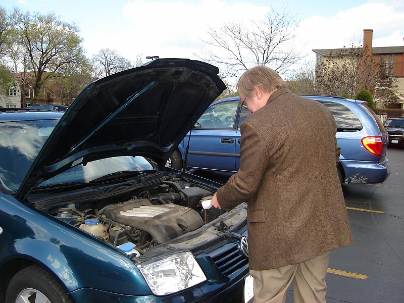 DSC00880.JPG - Bill assessing oil troubles - putting in a quart did the trick. 28 April 2007