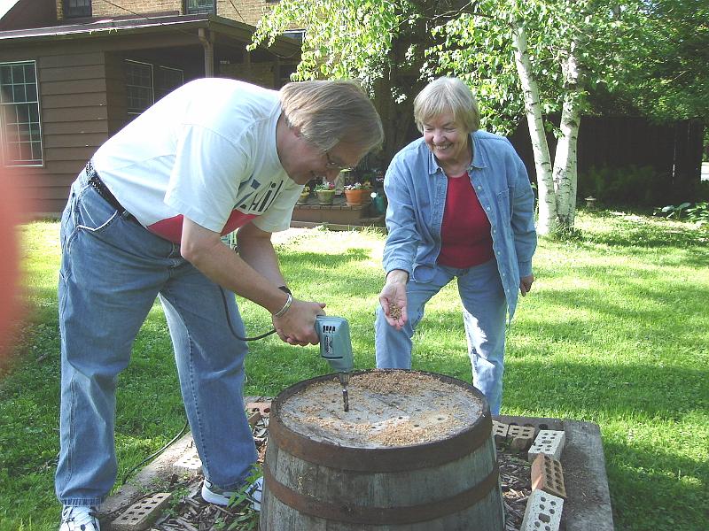 DSC00921_00.JPG - Bill drills holes in Vada's barrel so it will work as a planter. 27 May 2007