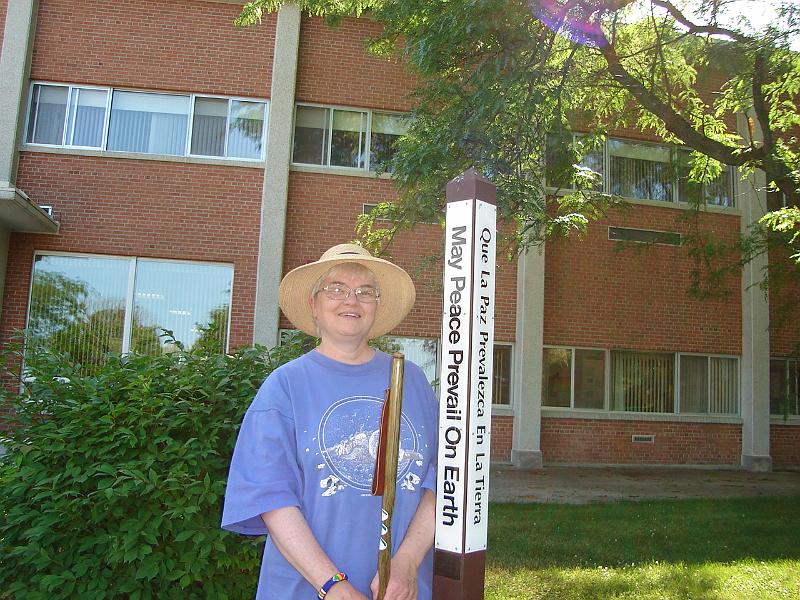 DSC00961.JPG - Judy in front of peace pole in Sinsinawa. 27 June 2007