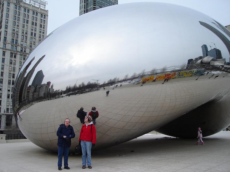 DSC02216.JPG - Bill and Andrew in front of the "Bean", with Judy the photographer; the Ice Sculpture and the Lake Michigan Lake Front reflected.  Chicago 21 February 2008