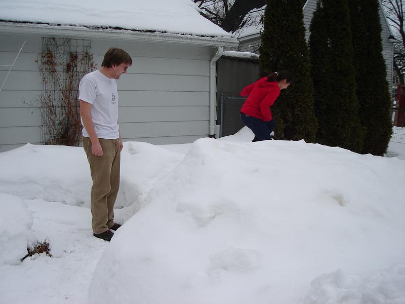 DSC02250.JPG - Sara, who is from Colombia, venturing into deep snow while Andrew watches. 1 March 2008