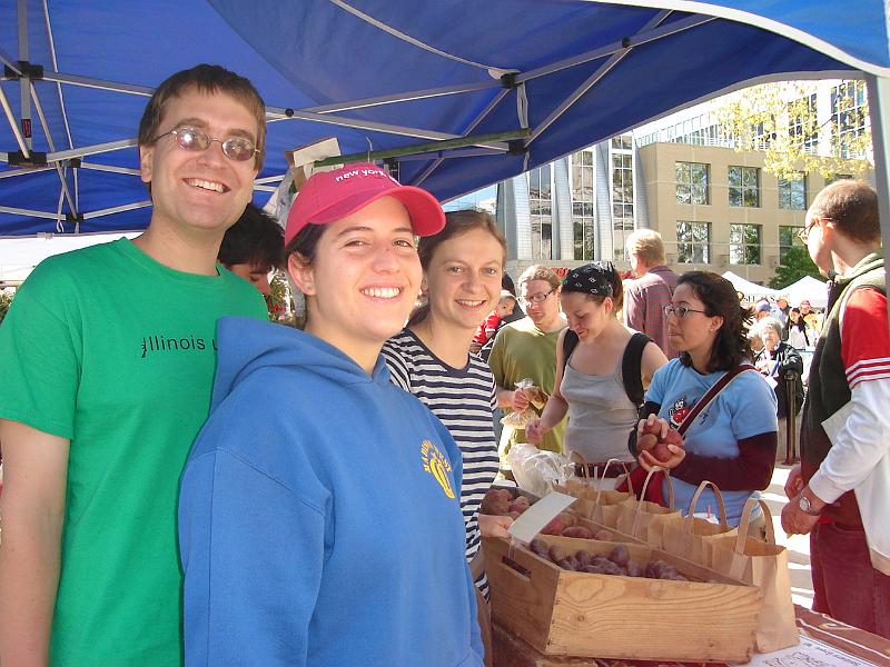 DSC02760.JPG - Andrew, Brenda, and vendor selling fingerling potatoes at the Farmers Market around the Capitol square in Madison. 17 May 2008