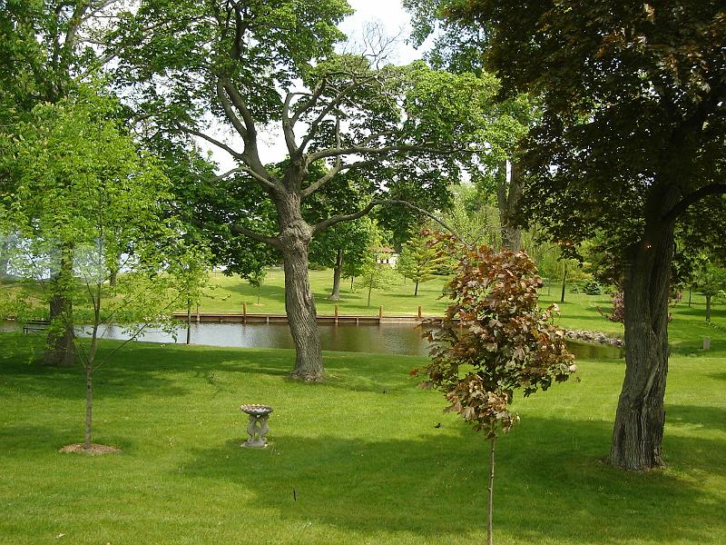 DSC02886.JPG - An inlet from Lake Winnebgo, extending onto the property of the Jesuit Retreat House.  In the background, through the trees, you can see the Sacred Heart Chapel. 30 May 2008