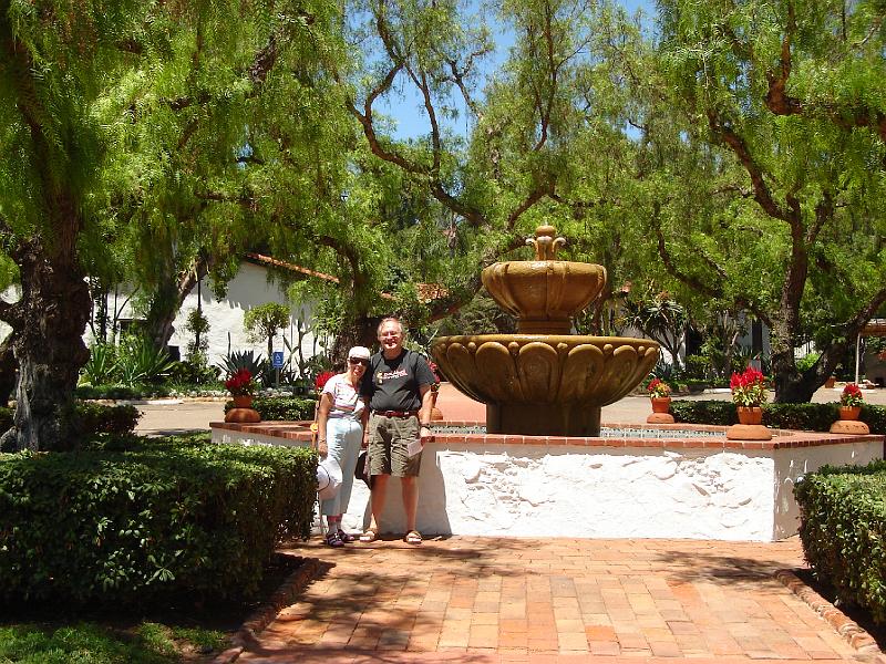 DSC00099.JPG - Ramona and Bill by the fountain in the Mission San Diego de Alcala 11 August 2008