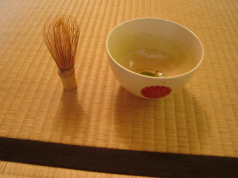 DSC00181.JPG - A tea cup and the whisk that whipped the tea for the Tea Ceremony at the Japan House.  The whisk is made from a single piece of bamboo. 14 August 2008