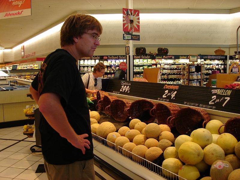 DSC00206.JPG - Andrew trying to decide what snack to take for the crew at Blue Moon farm.  Urbana 15 August 2008