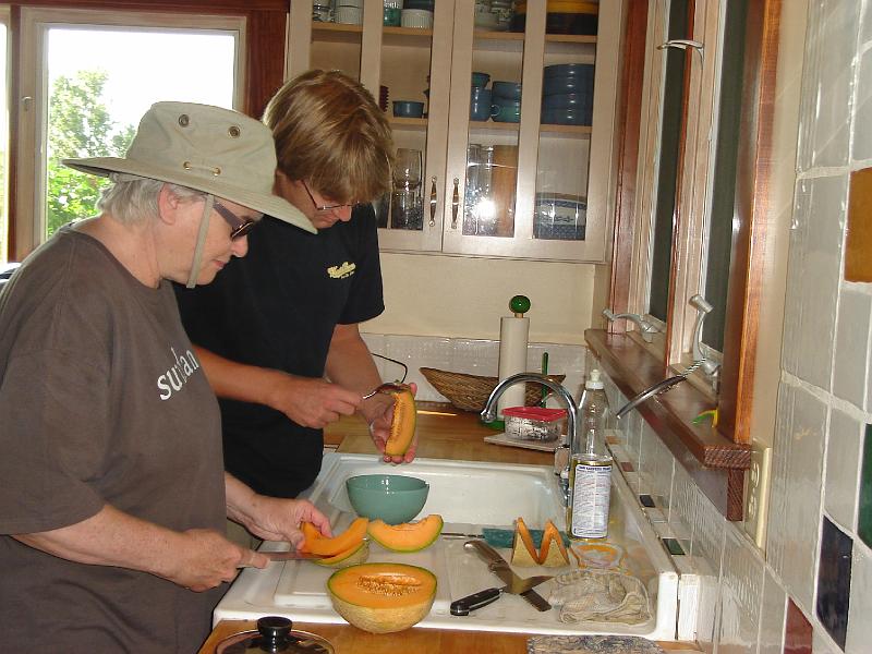DSC00208.JPG - Judy and Andrew preparing the snack at Blue Moon Farm, Andrew decided on cantaloupe.  Urbana 15 August 2008