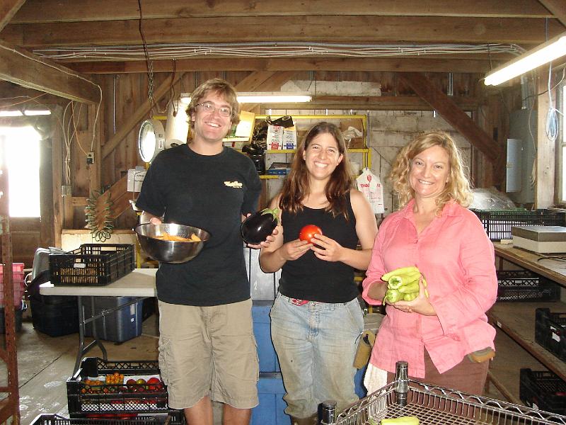 DSC00209.JPG - Andrew, Brenda, and Ann-Marie, displaying the fruits of their labors at Blue Moon Farm Urbana 15 August 2008