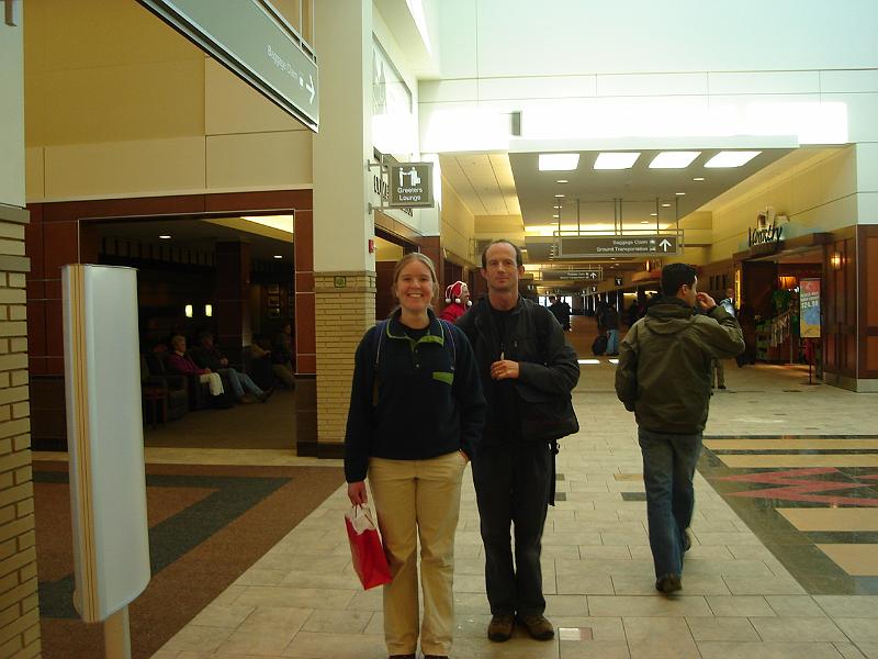 DSC00621.JPG - Gretchen and Matt at the Madison airport on Christmas Day, five days late.  Notice the bag.  Notice how calm.  Notice how happy Gretchen appears. 25 December 2008