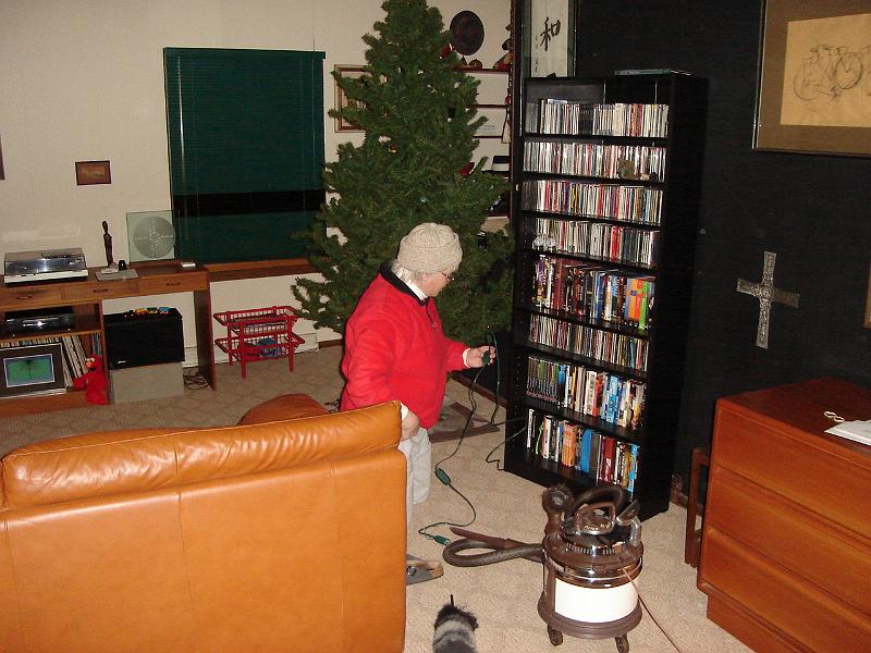 DSC00637.JPG - Getting ready for a postponed, because of airport closing weather in Seattle, Christmas.  Judy cleaning and plugging in extention cords. 26 December 2008