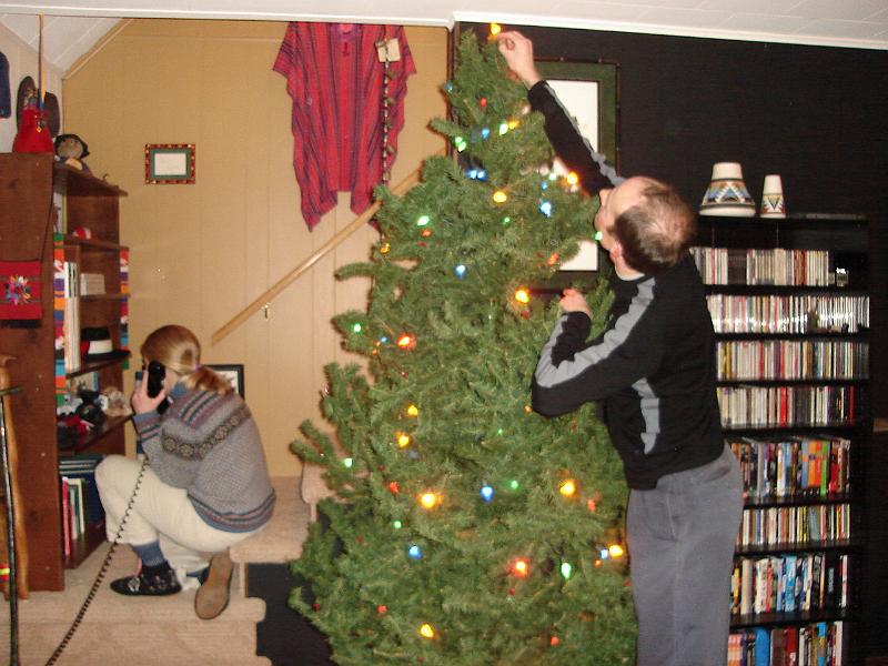 DSC00642.JPG - Gretchen + 1 on phone, Matt still hanging lights. 26 December 2008