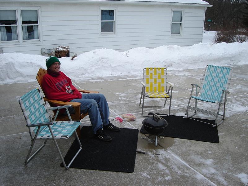 DSC00743.JPG - Chairs are out.  Brats are steaming.  Carpeting on the icy driveway. 1 January 2009