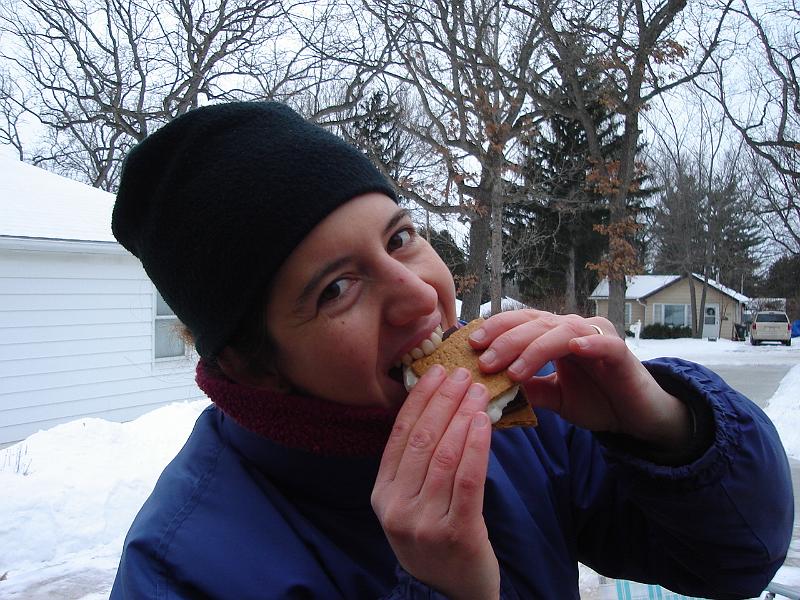 DSC00771.JPG - Brenda likes her s'mores. 1 January 2009