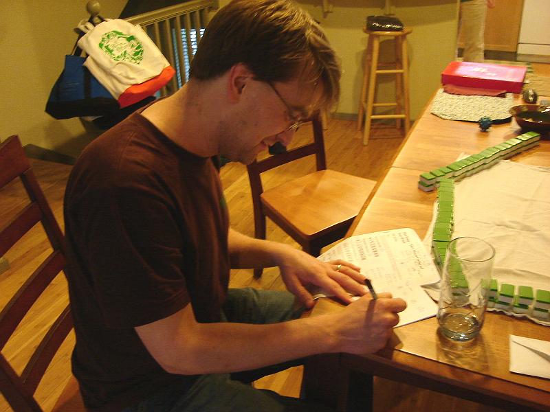 DSC00955.JPG - Andrew getting ready to teach us how to play Mah Jong (see next picture). 2 May 2009